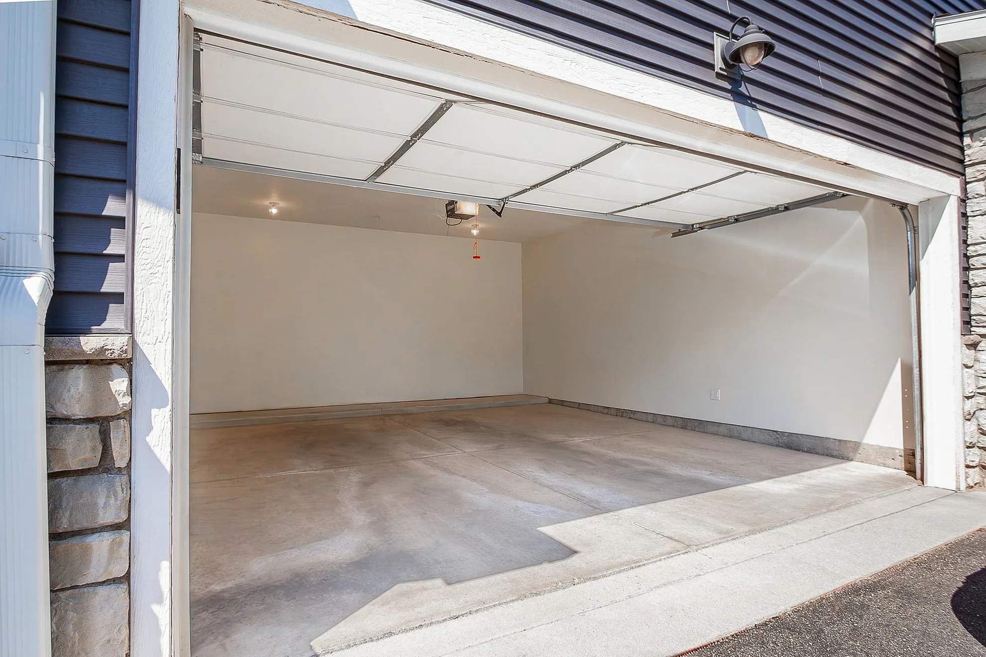 Spacious modern garage with sleek design and ample light, perfect for customization and secure parking.
