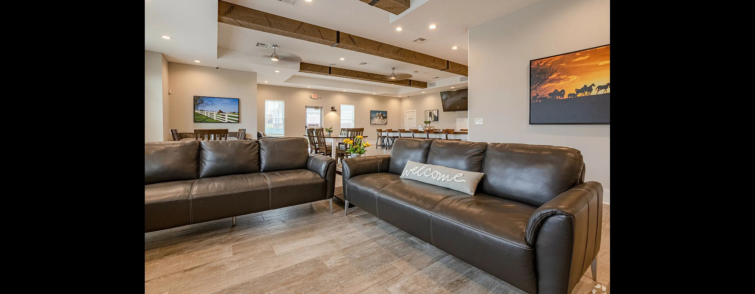 Inviting lounge area with sleek leather sofas, warm lighting, and elegant decor, perfect for relaxation and social gatherings.
