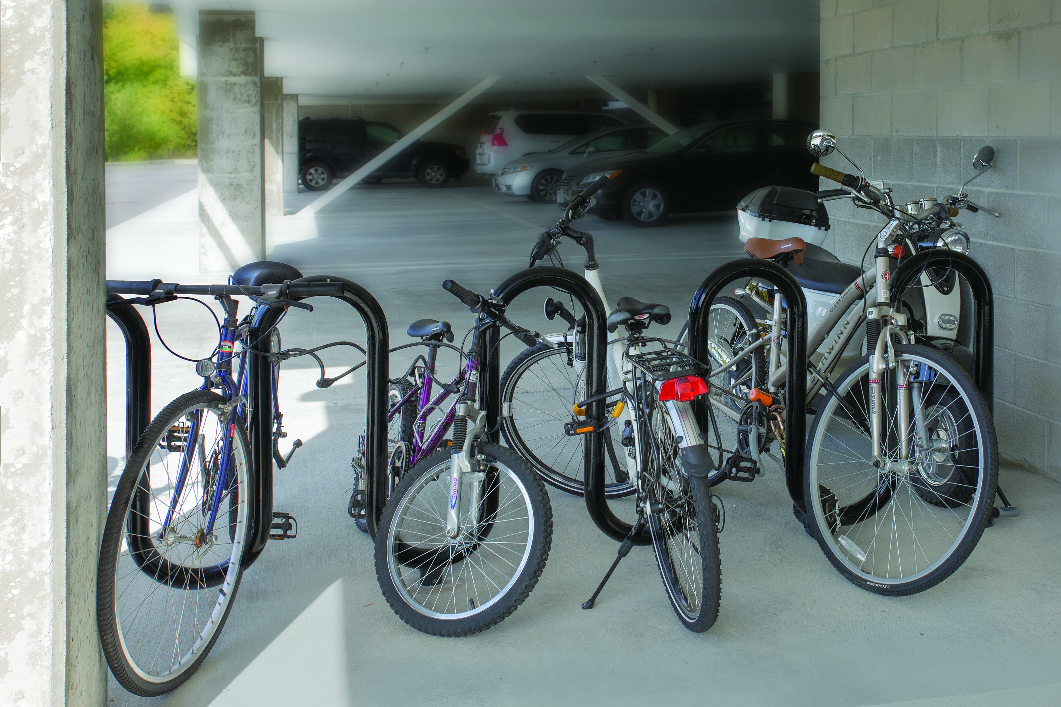 Inviting basement parking area with secure bike racks and ample vehicle spaces, ideal for urban commuters.