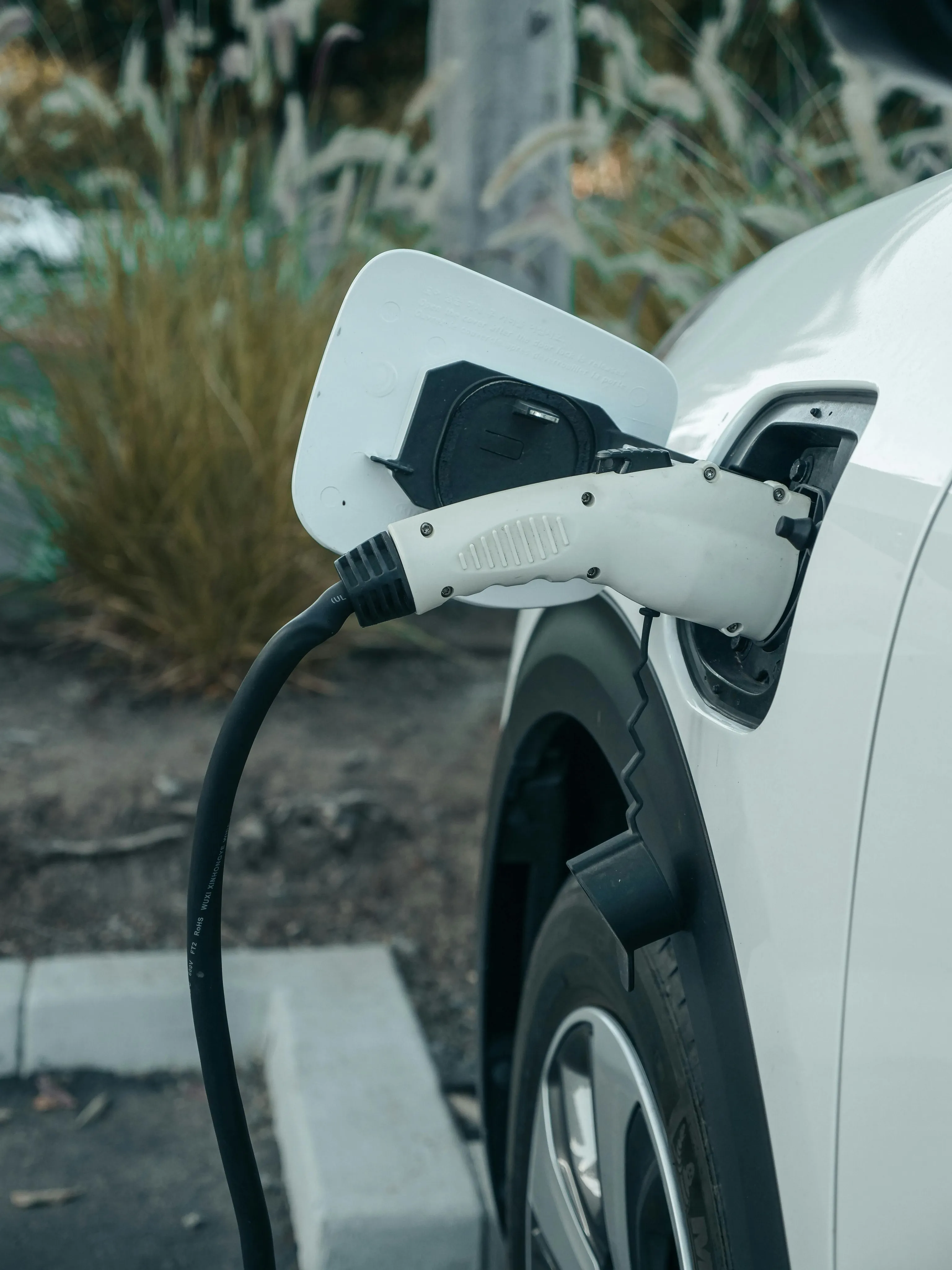 Efficient electric car charging with sleek design in a modern urban setting.