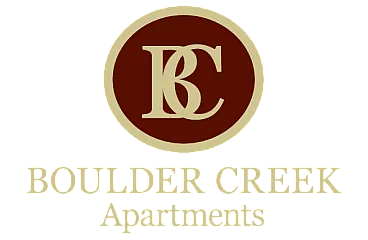 Elegant Boulder Creek Apartments logo featuring a sophisticated gold and maroon design.
