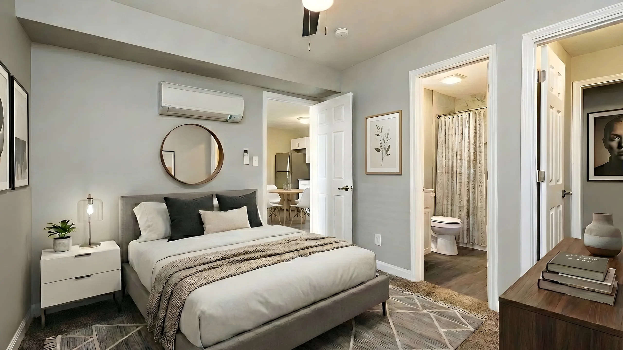 Elegantly designed bedroom featuring cozy lighting, modern decor, and an ensuite bathroom with contemporary fixtures.