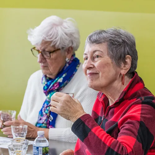 Two women enjoying a bourbon tasting