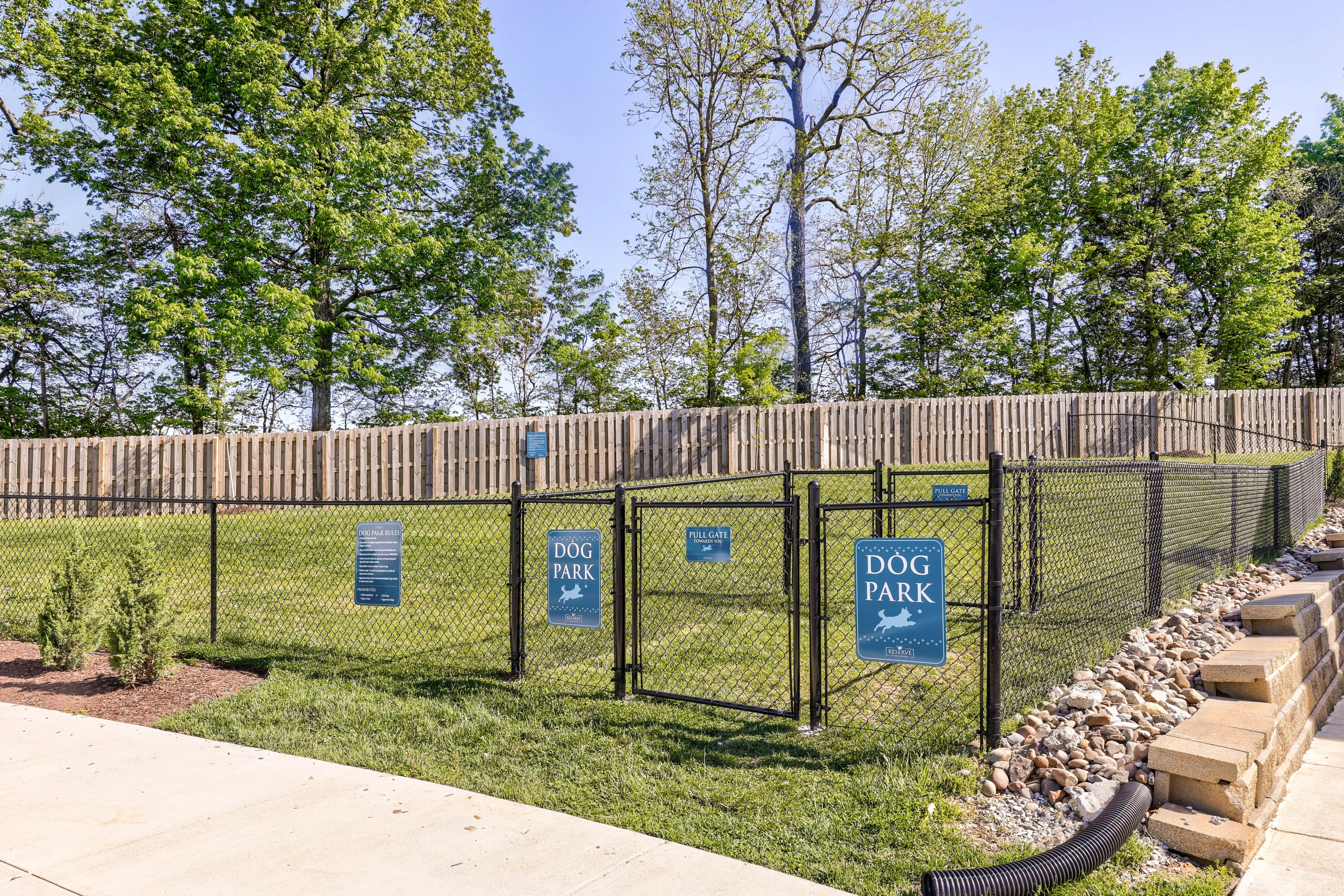 Charming and inviting dog park with a secure fence, perfect for pet lovers.