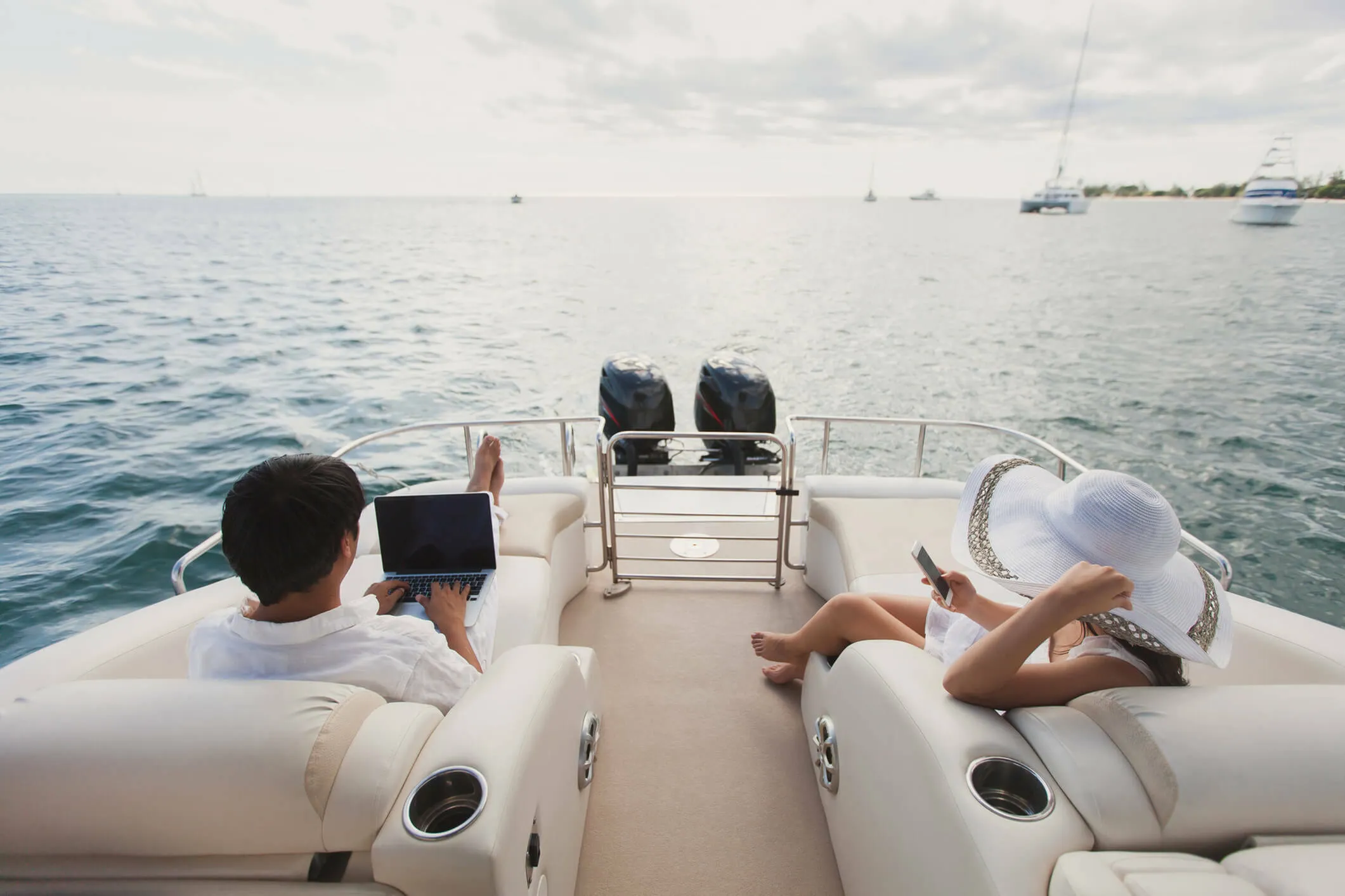 Luxurious yacht experience with serene ocean views; relaxing seating area perfect for work and leisure.