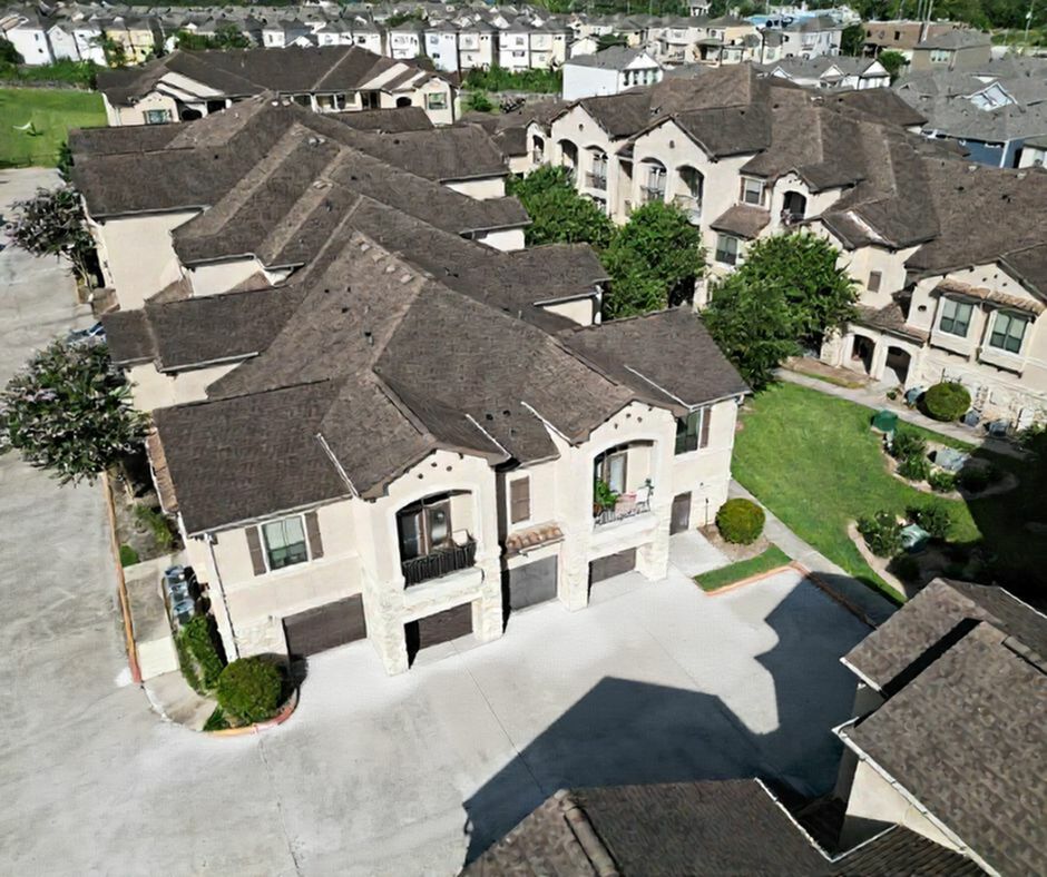 Charming residential community with elegant townhouses and lush green landscaping, offering a tranquil suburban setting.
