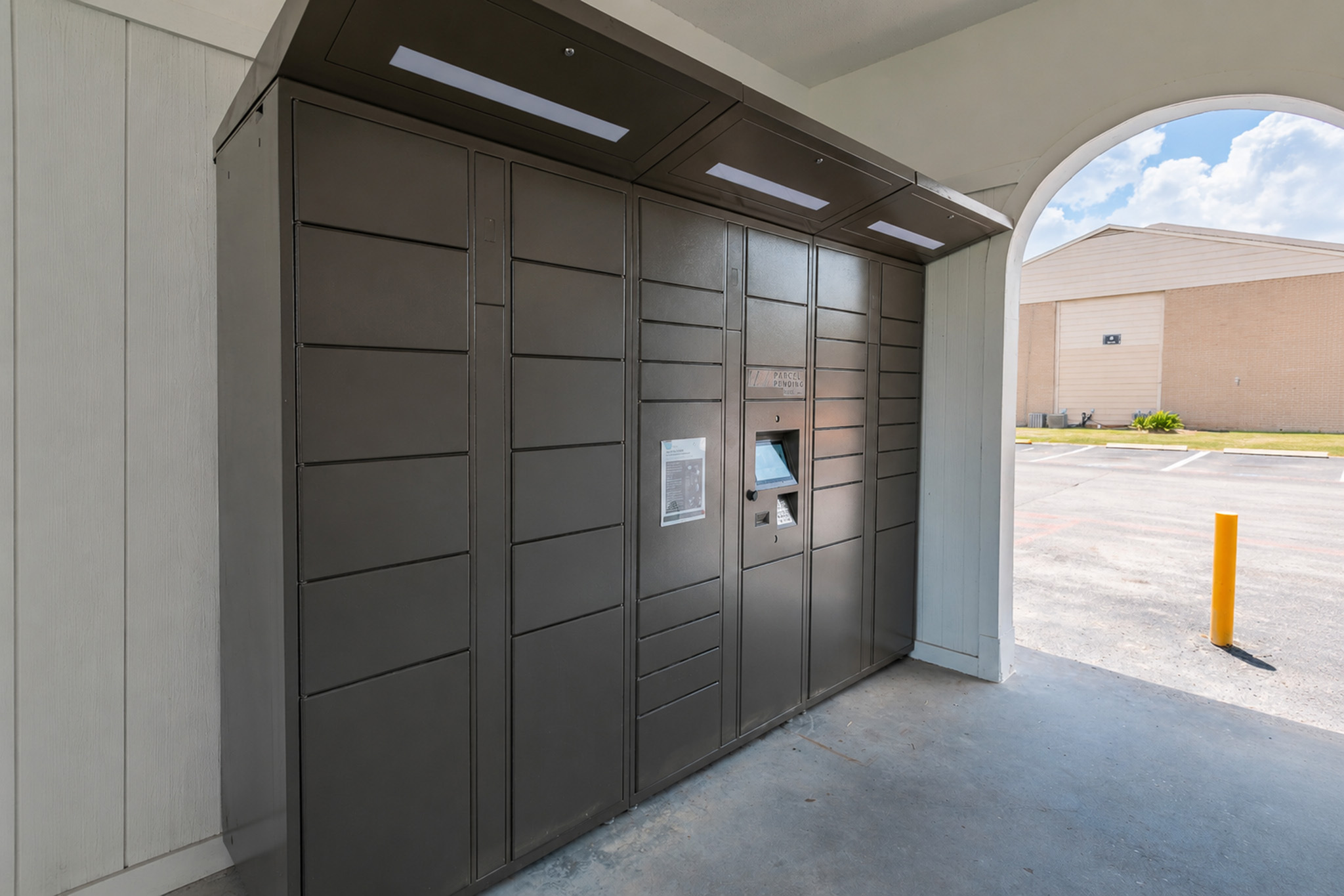 Modern apartment lobby with sleek parcel locker system for convenient package storage.