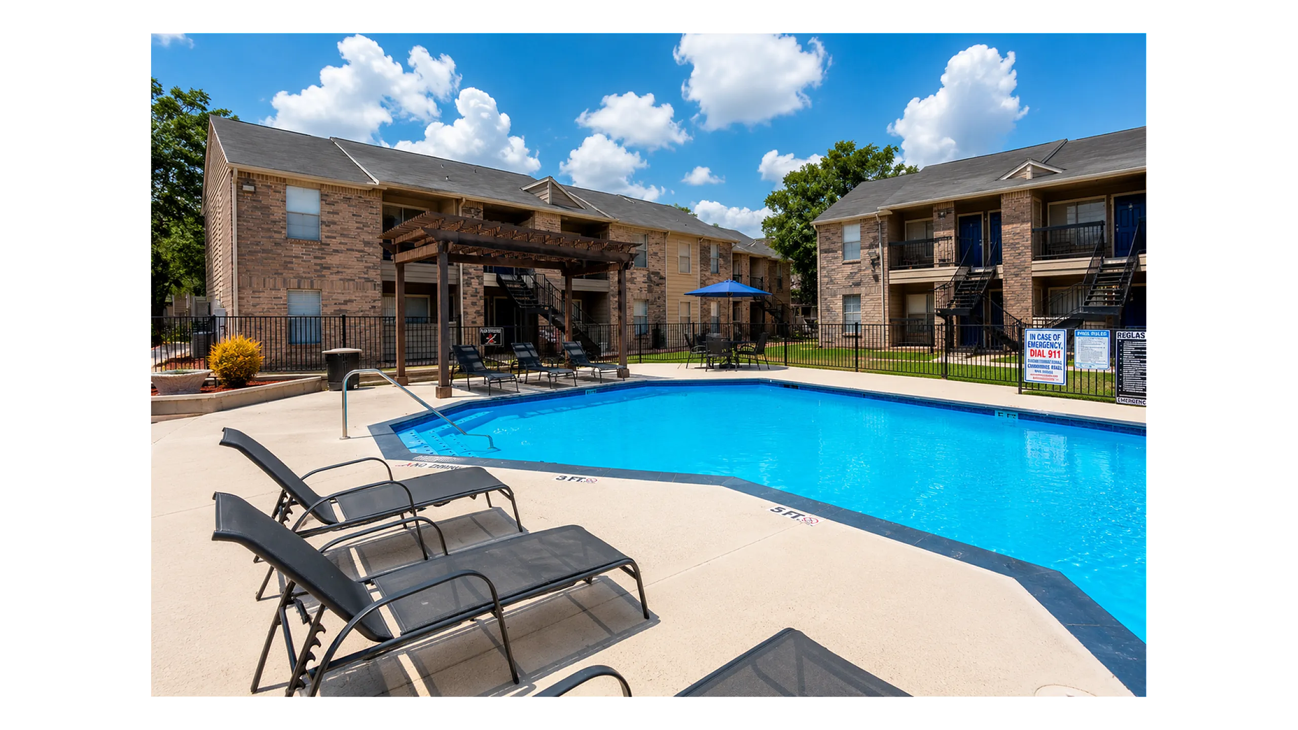 The swimming pool at Green Meadows Apartments features comfortable lounge seating, open sun deck space, and a relaxing community atmosphere in Houston, TX.