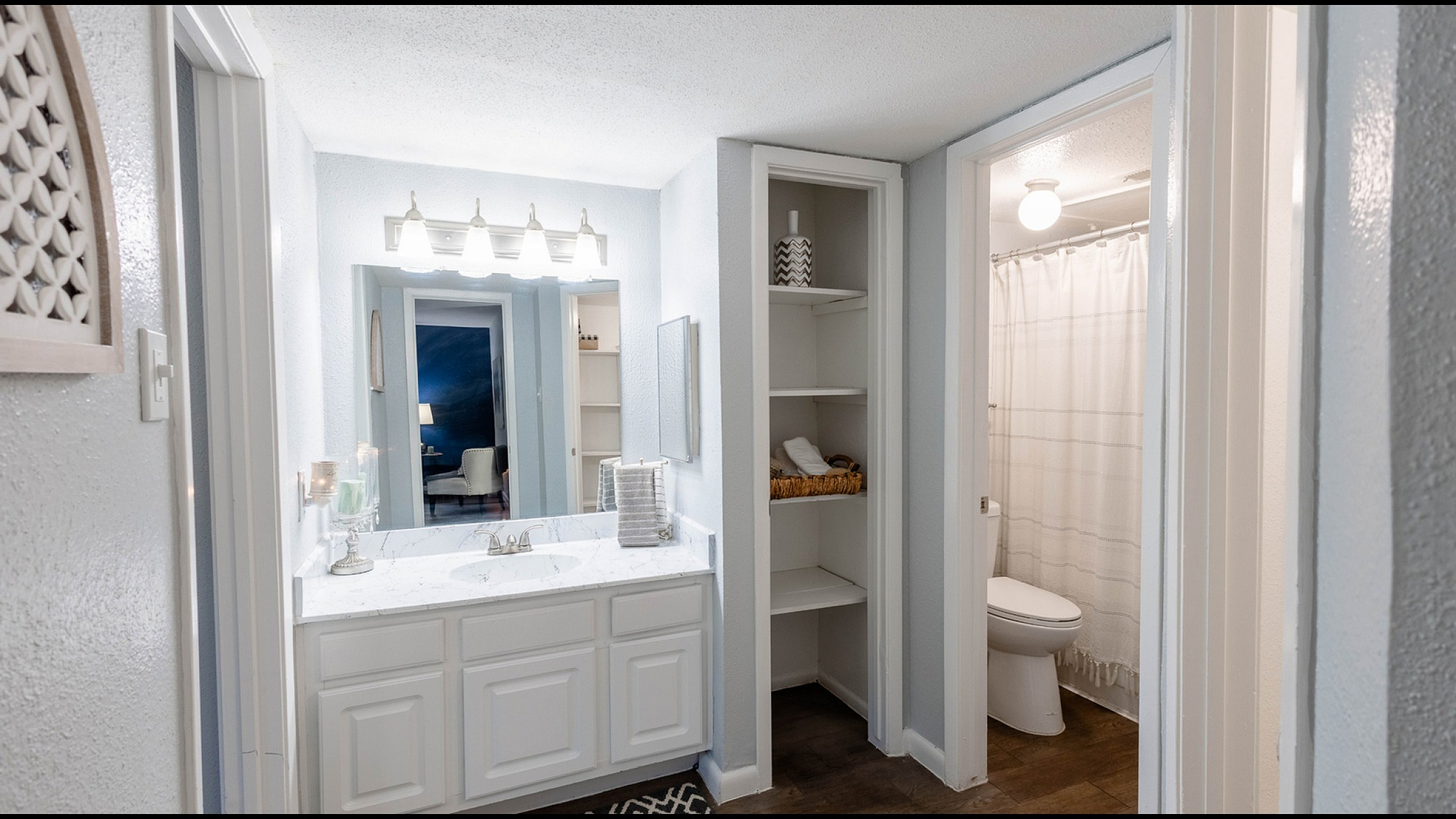 Model apartment bathroom at Steeplechase Apartments in Alvin, TX