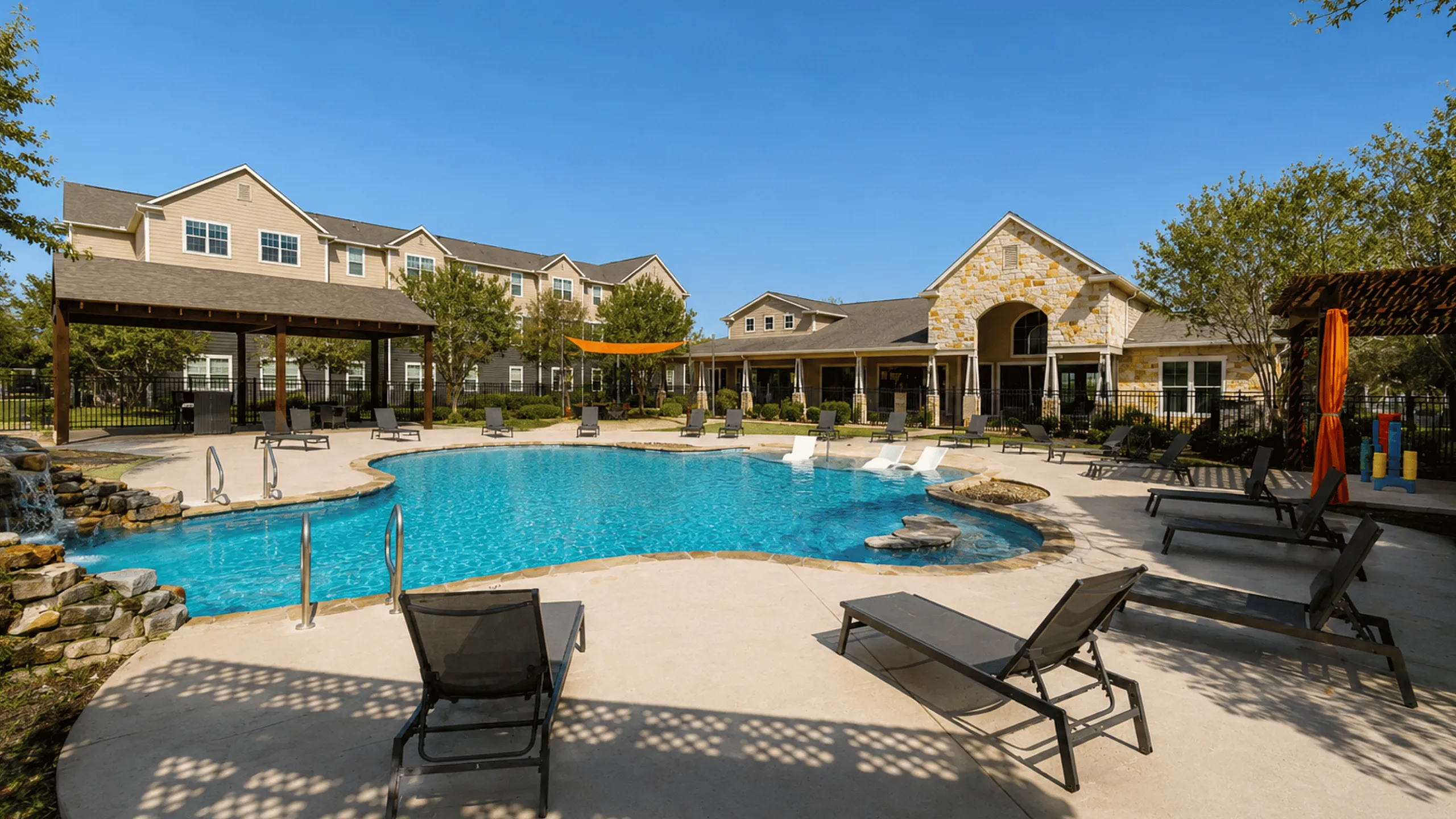 Resort-style pool at Oak Tree Apartments in Kingsville, TX, offering residents a relaxing outdoor recreation area.