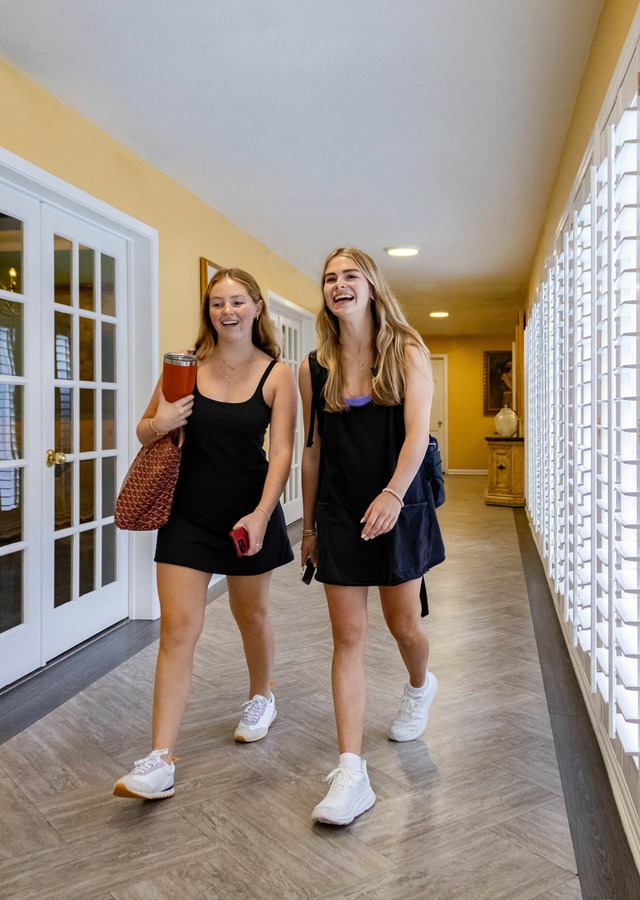 Girls Walking Hallway