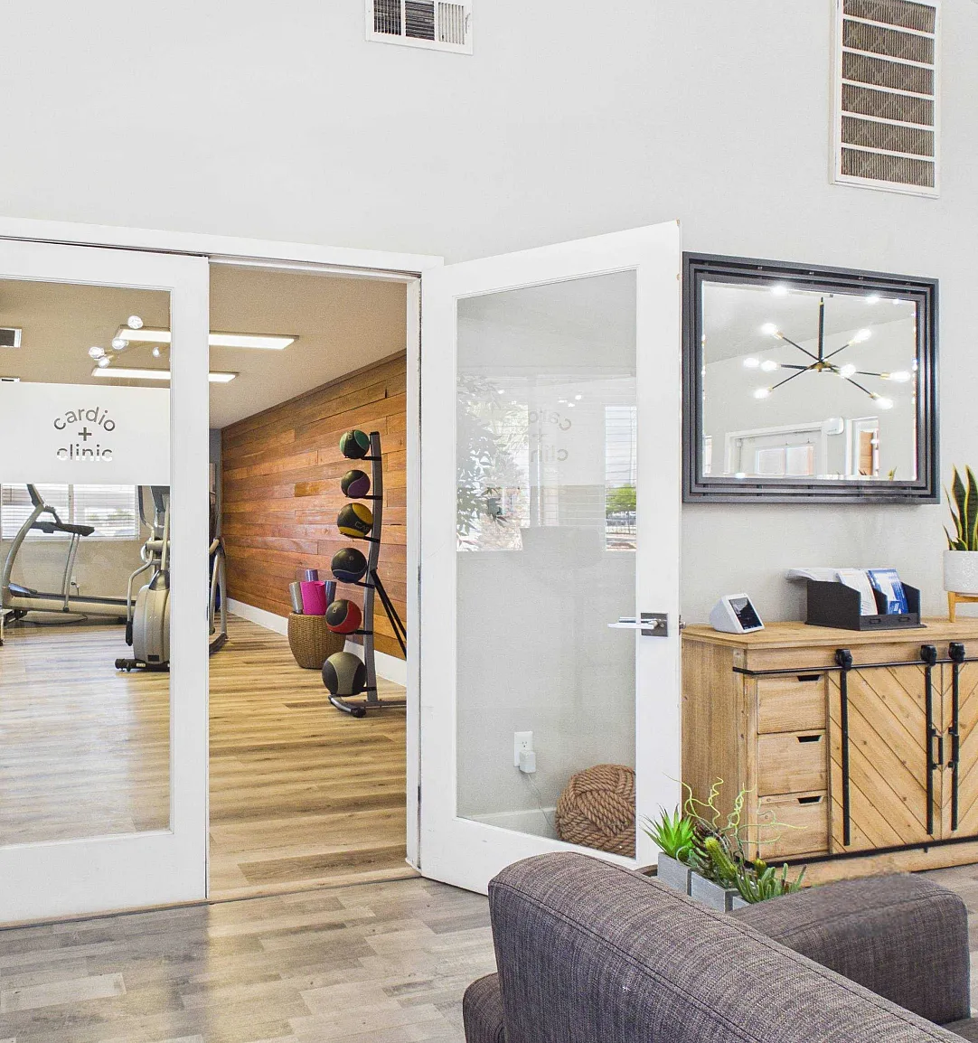Inviting fitness area entry with stylish decor and modern equipment, perfect for an active lifestyle.