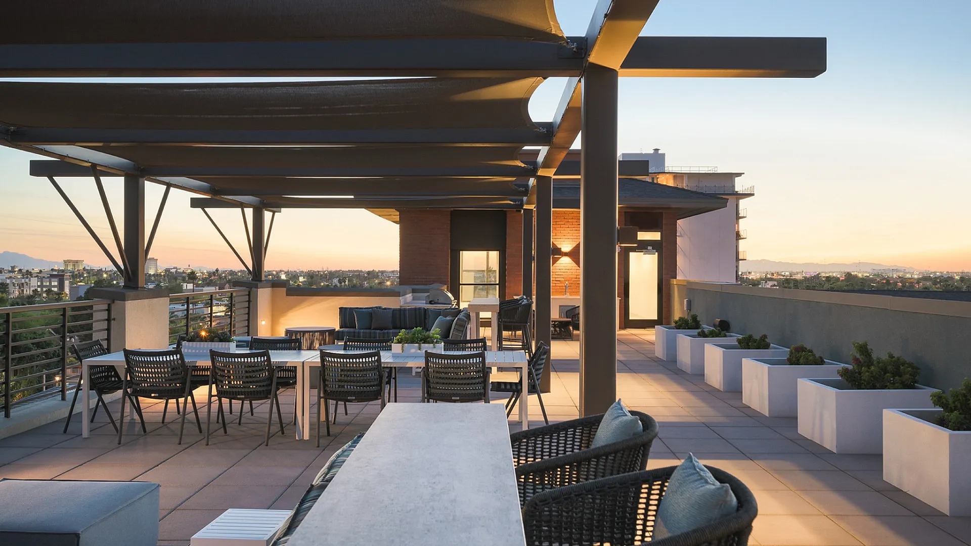 Stunning rooftop terrace with modern seating and gorgeous sunset views, perfect for outdoor entertaining.