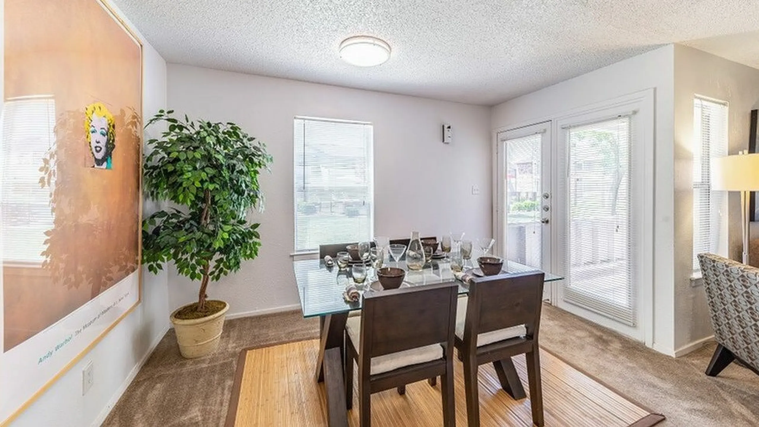 The dining area has a view of the kitchen and living area.