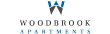 Elegant logo of Woodbrook Apartments featuring a stylish blue and gray design symbolizing modern luxury living.