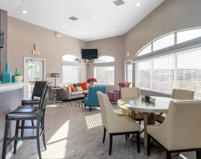 Bright and inviting living space with modern furnishings, large windows, and stylish decor in cozy apartment setting.