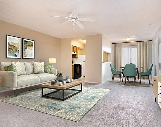 Elegant apartment living room featuring cozy seating, modern decor, and an open dining area with stylish furniture.