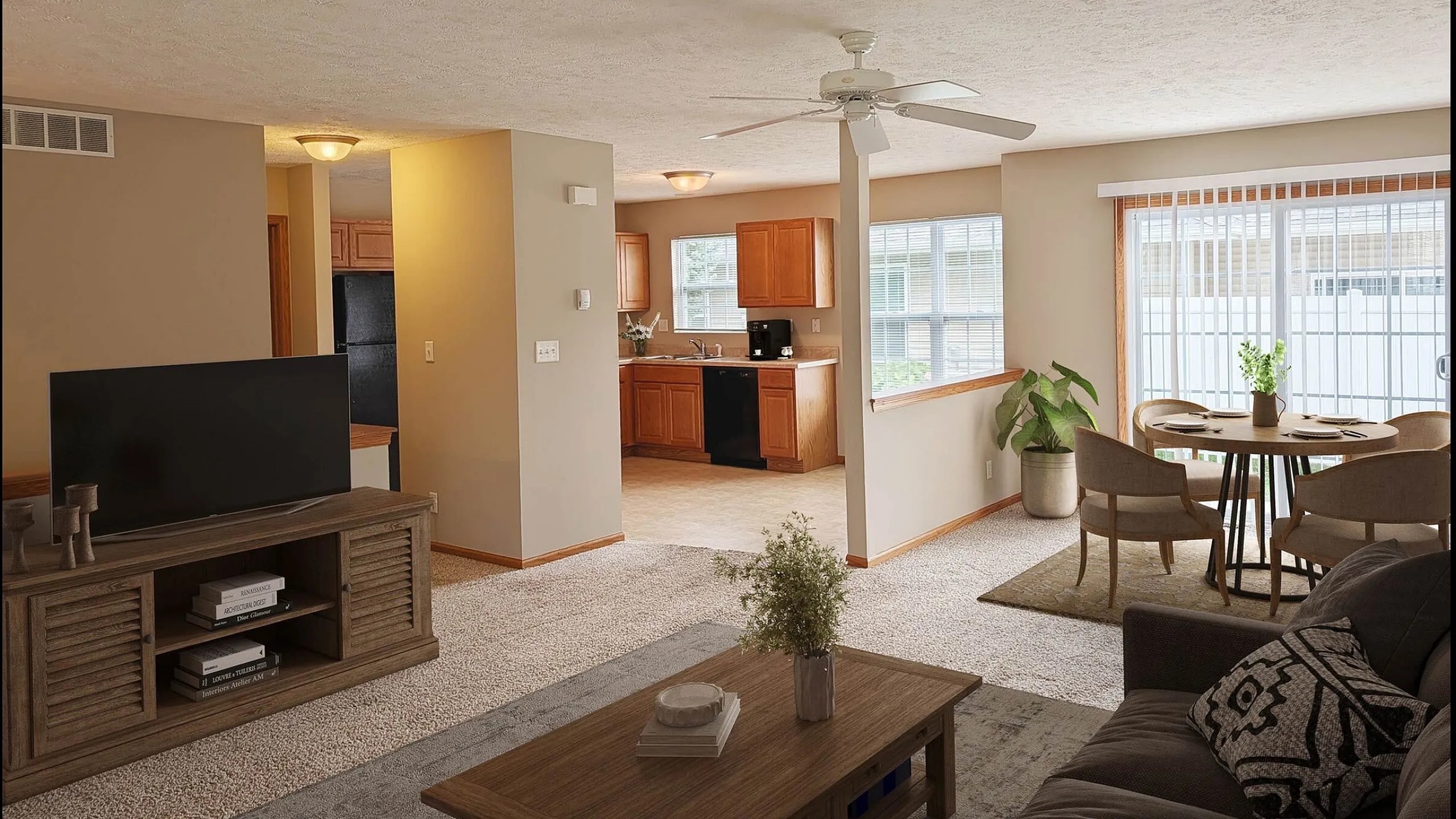 Inviting open-concept living area with cozy seating, large windows, and a modern kitchen adjacent to a chic dining space.
