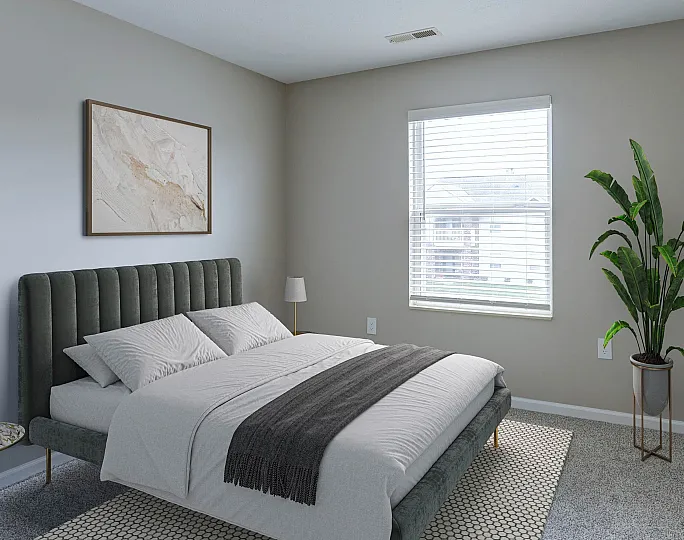 Bright and cozy bedroom with a plush bed, elegant wall art, large window, and a vibrant green plant accent.