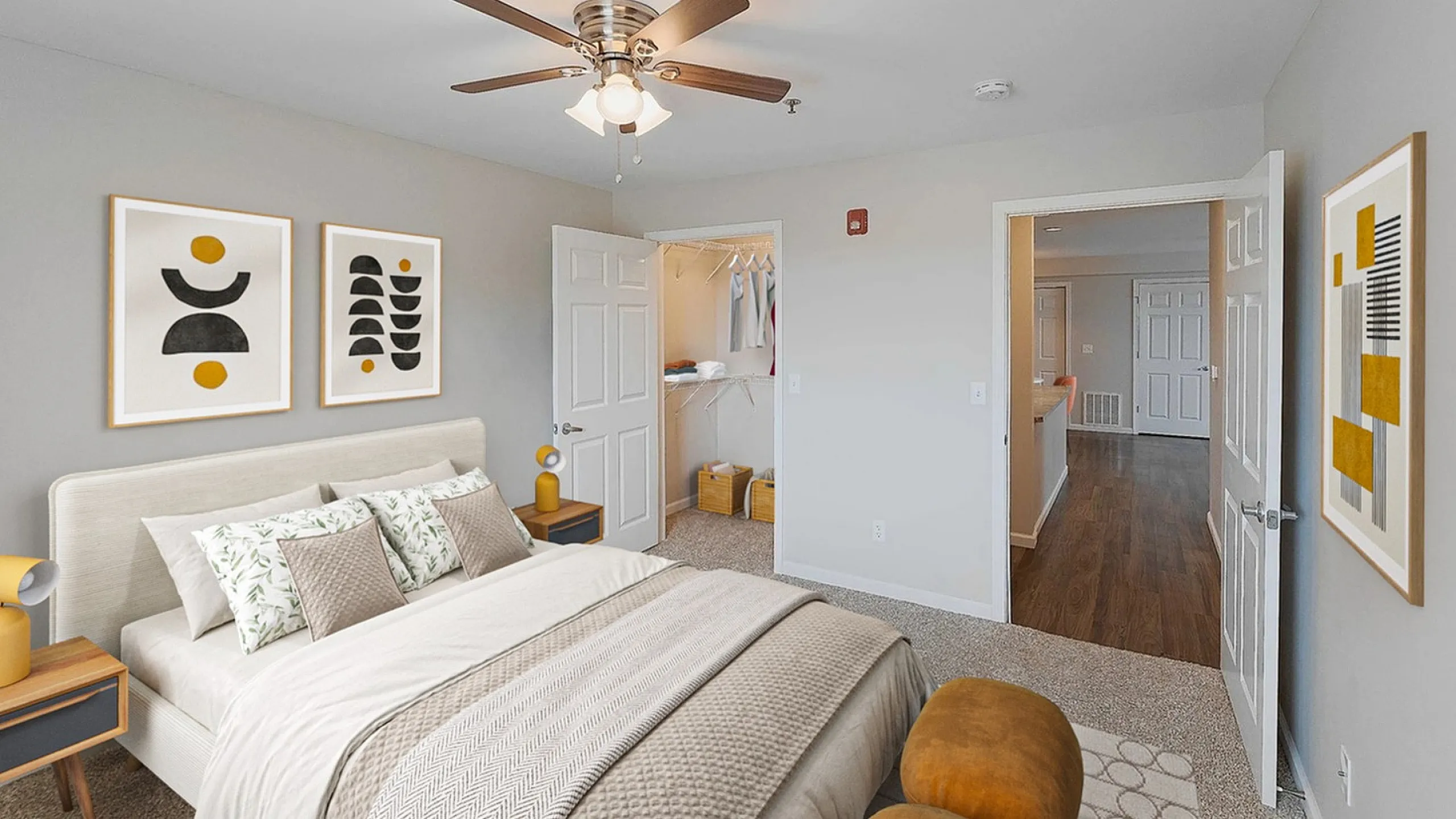 Inviting bedroom with modern decor, featuring a cozy bed, stylish artwork, and a spacious walk-in closet.