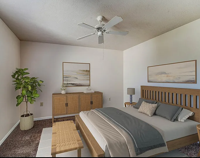 Inviting bedroom with natural light, featuring a stylish wooden bed, elegant sideboard, and lush indoor plant, creating a serene and cozy atmosphere.