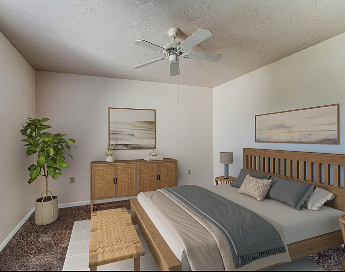 Elegant bedroom with a cozy bed, stylish wooden furniture, and abundant natural light from a large window.