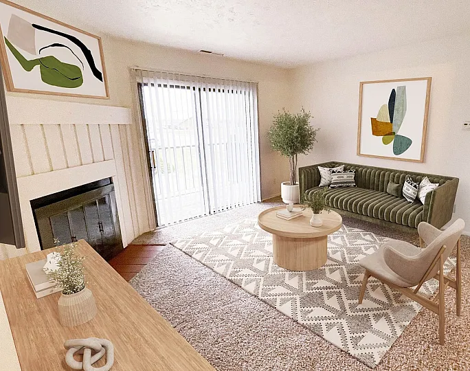 Inviting living room with cozy fireplace, elegant decor, and plush seating, leading to a bright balcony through glass doors.