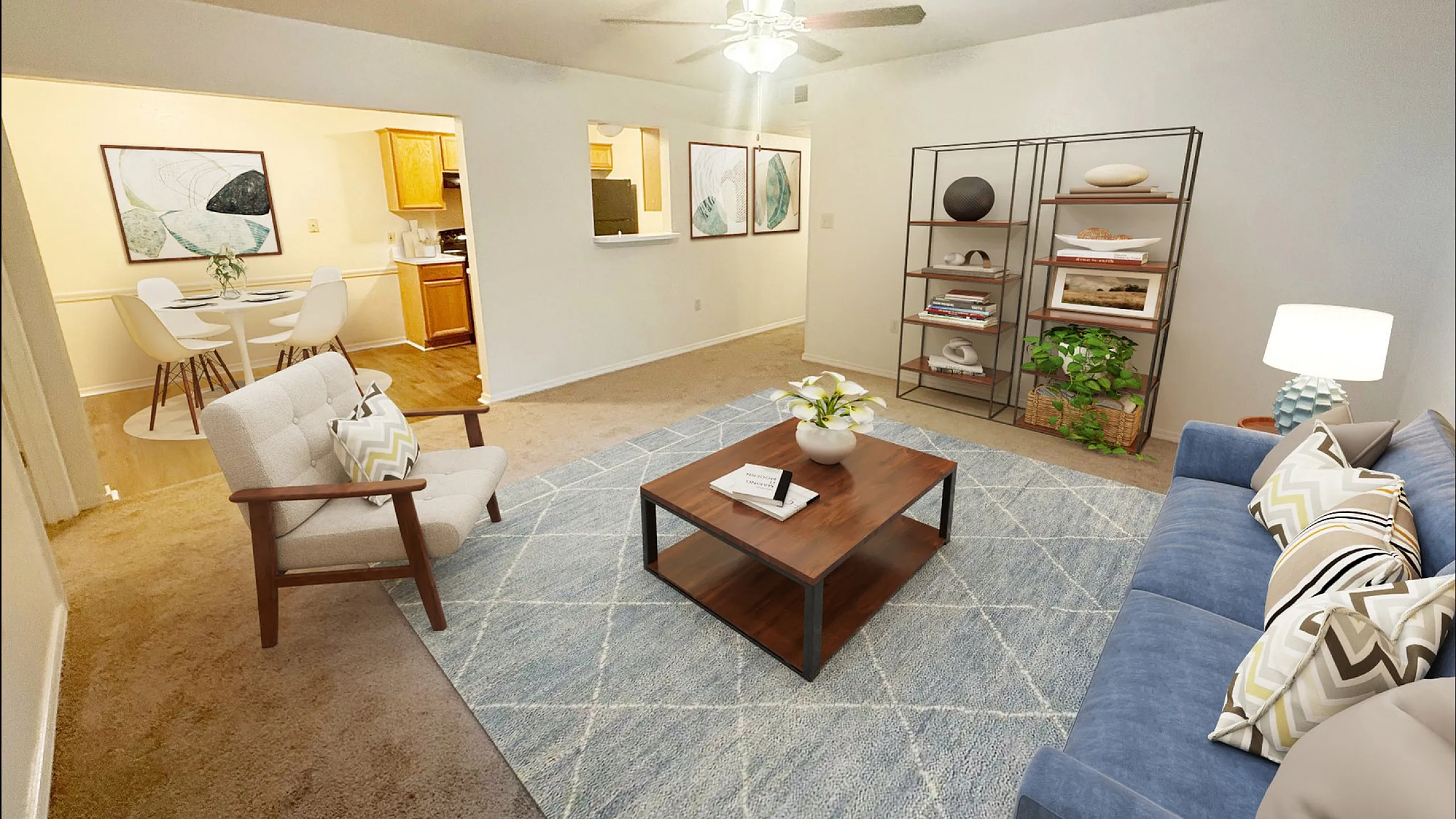 Inviting living room with modern decor, featuring a plush blue sofa, elegant coffee table, and open dining area with chic accents.