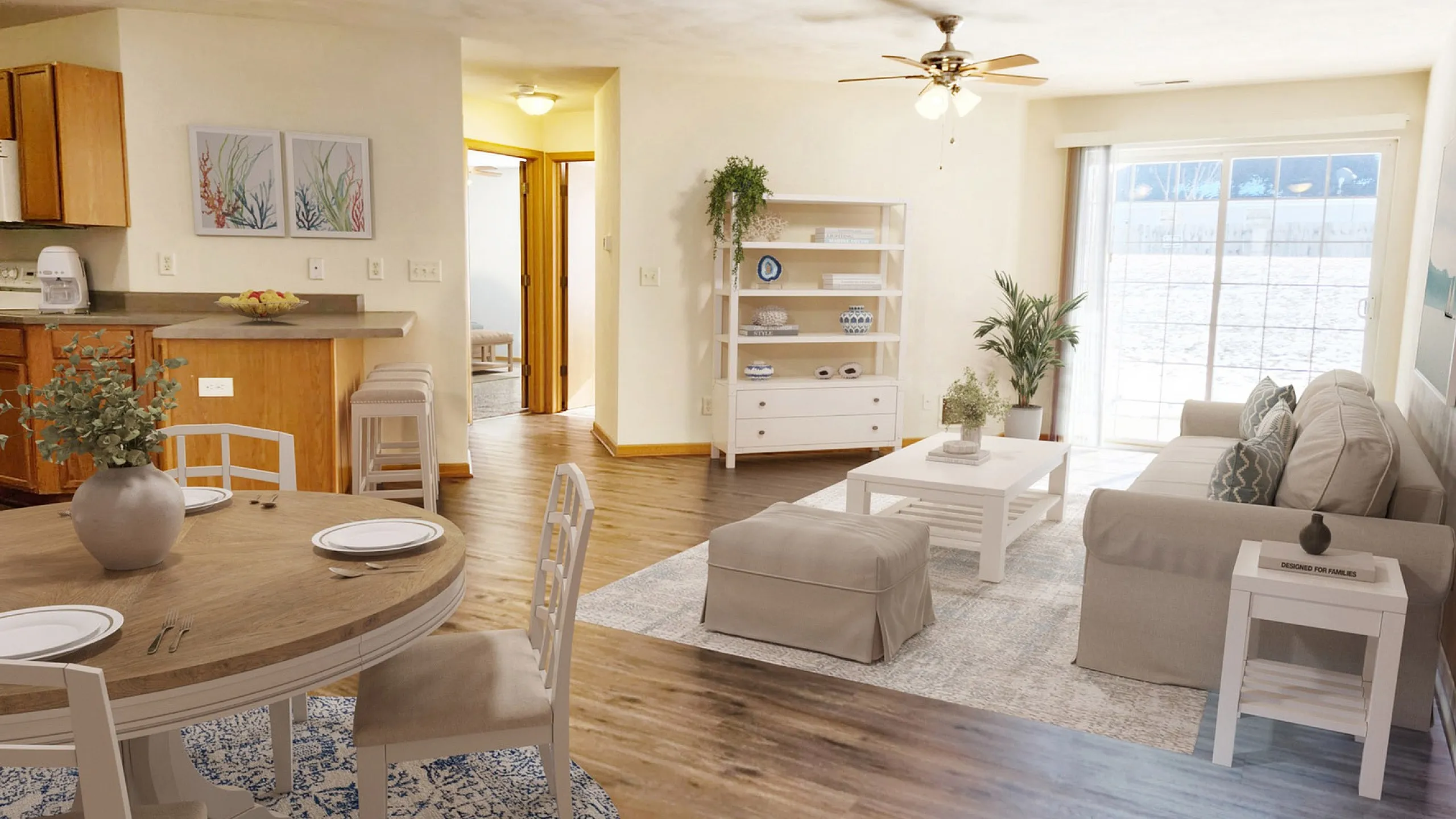 Inviting open-concept living room with elegant decor, cozy dining area, and natural light streaming through glass doors.