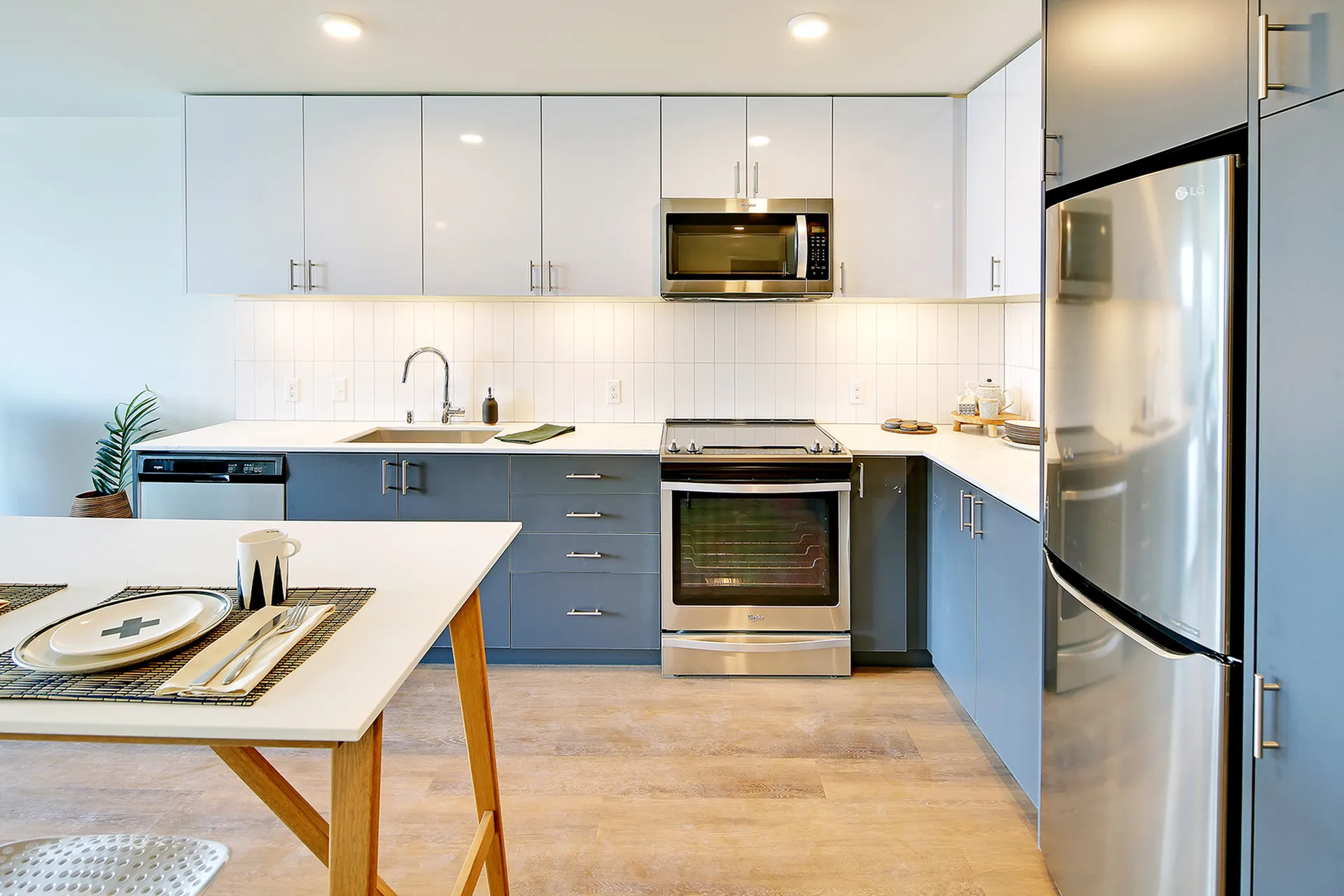 Sleek modern kitchen with stainless steel appliances, elegant cabinetry, and a spacious countertop perfect for home chefs.