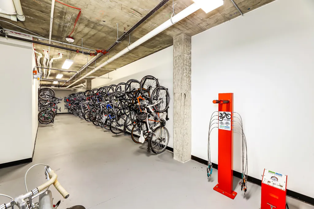 Spacious and secure indoor bicycle storage area with modern racks, ideal for urban cyclists.