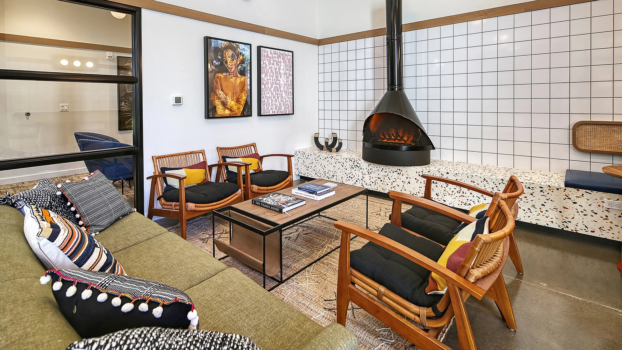 Chic living room with modern fireplace, stylish seating, and vibrant decor, perfect for cozy gatherings.