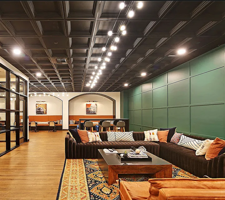 Sophisticated and spacious lounge with stylish seating, modern lighting, and vibrant decor that adds warmth and luxury.