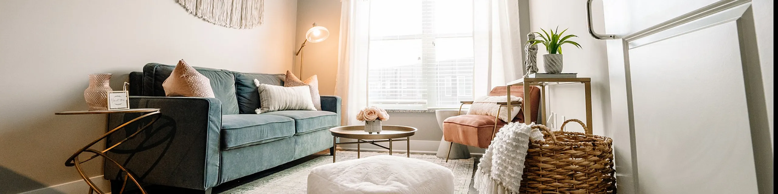 Inviting living room with cozy seating, warm lighting, and natural accents, perfect for relaxation and entertaining.