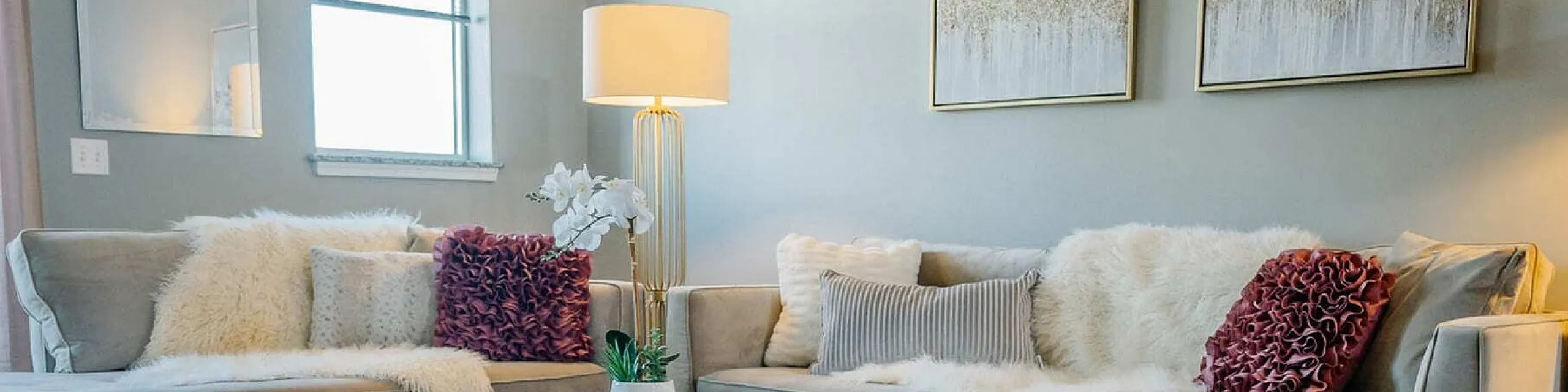 Elegant and inviting living room with plush sofas, chic decor, and soft lighting, offering a cozy and stylish ambiance.