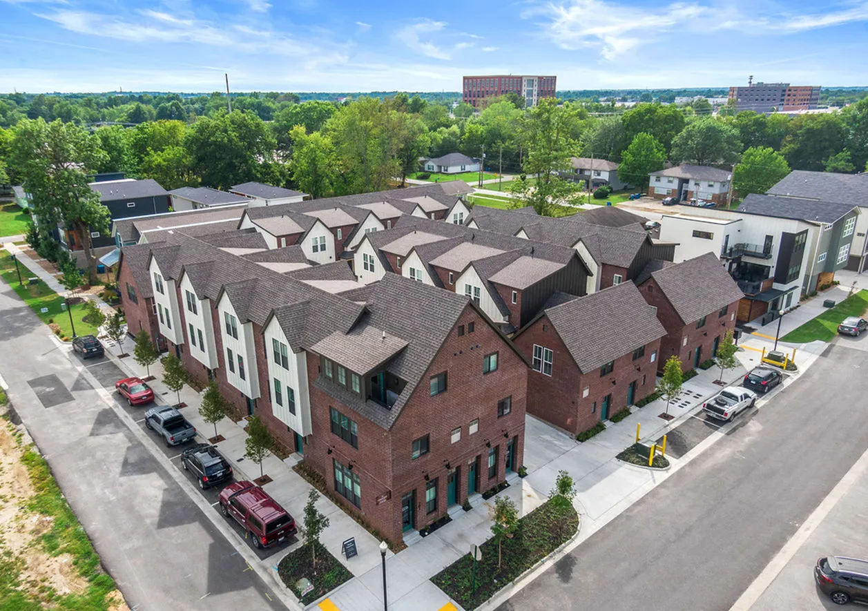 Aerial view of brick townhomes at Depot 16 Flats & Townhomes in downtown Bentonville, AR