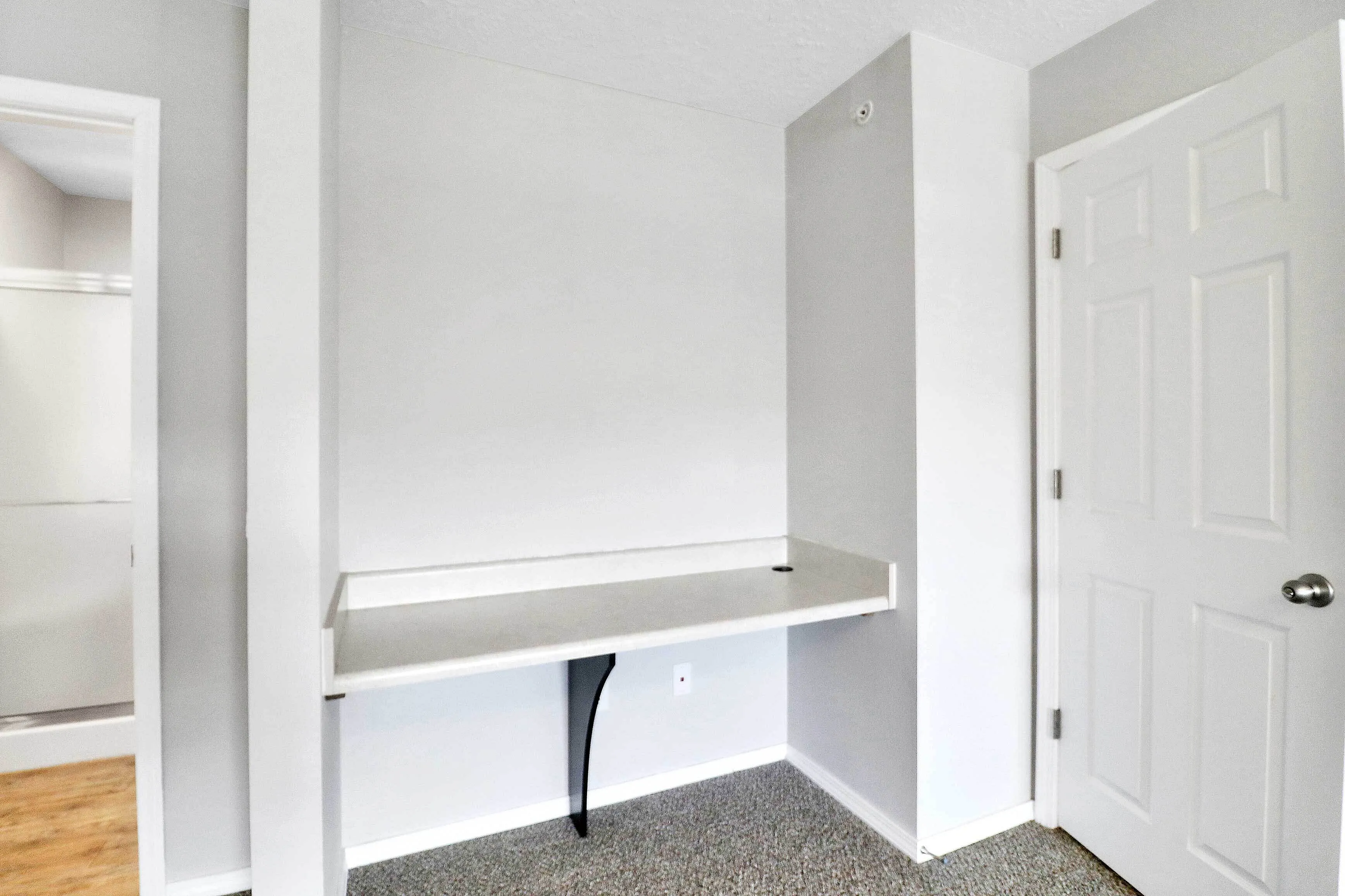 Cozy alcove featuring a sleek built-in desk with modern design, ideal for a minimalist workspace.
