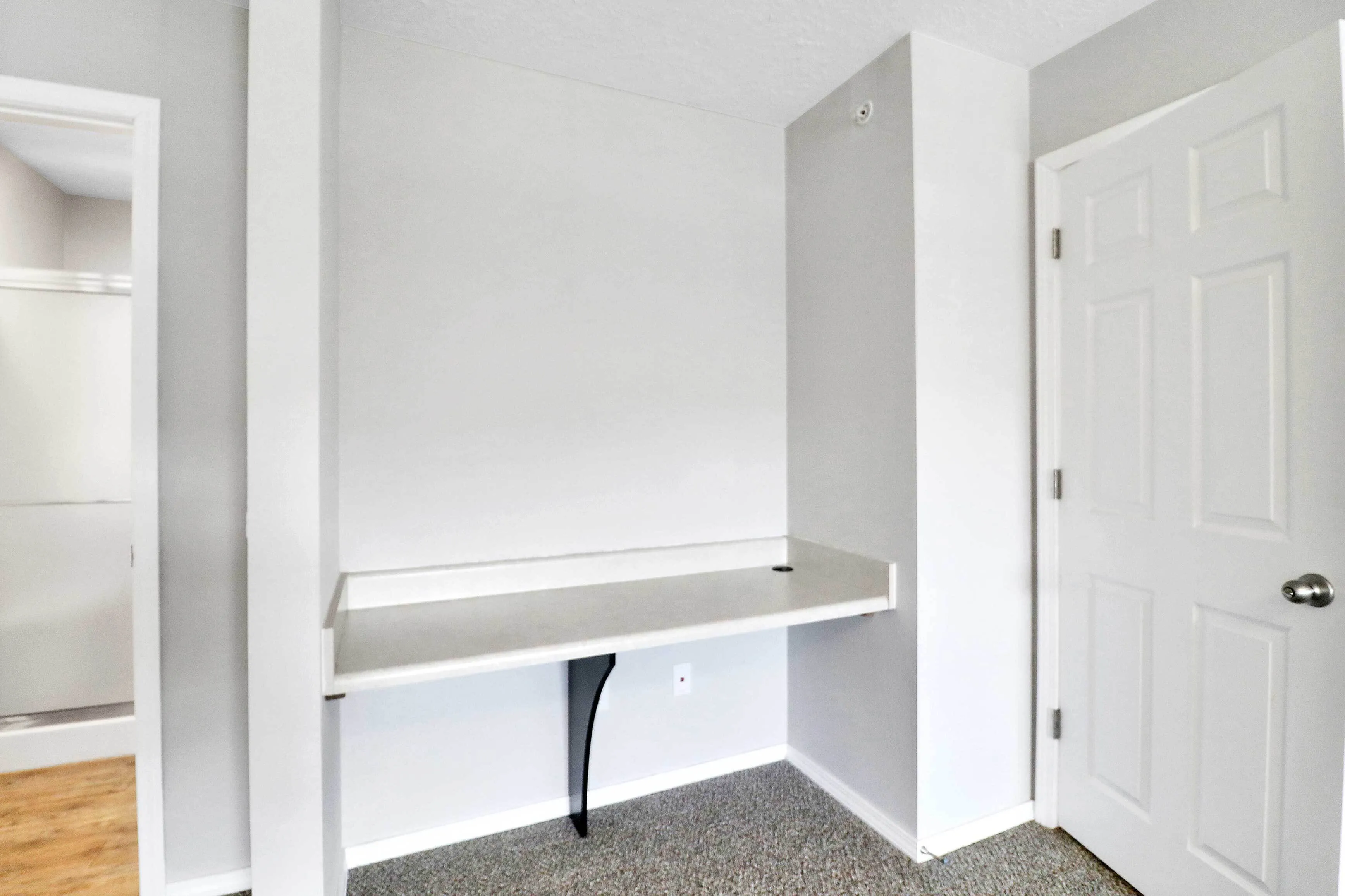 Modern minimalist office nook with sleek built-in desk, perfect for productive work from home setup.