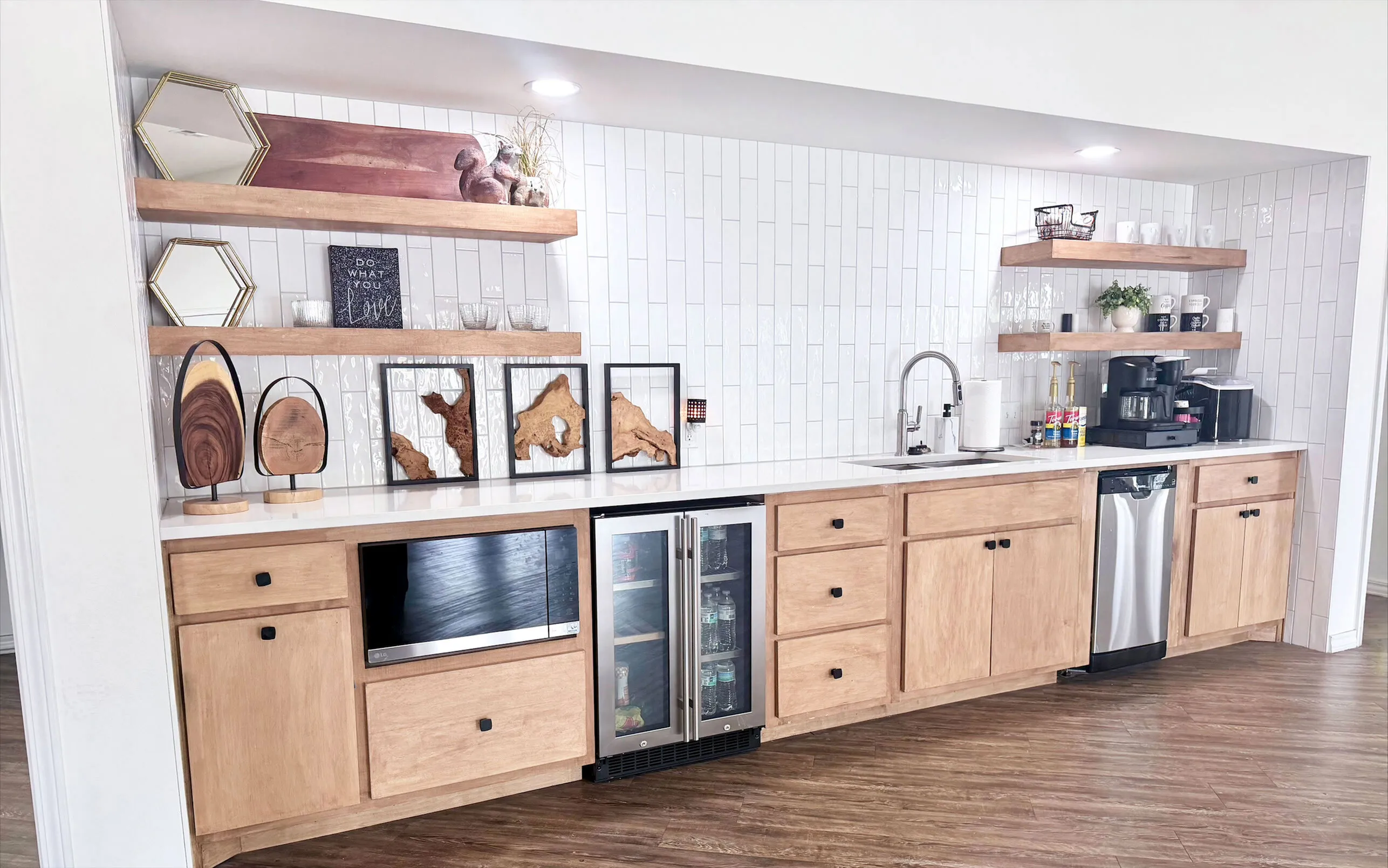 Modern kitchen design with open shelving, wooden cabinets, sleek countertop, built-in appliances, and stylish decor elements.