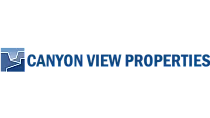Logo for Canyon View Properties, featuring a modern mountain-like design in blue.