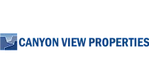 Canyon View Properties logo in bold blue font with a stylized mountain graphic, symbolizing quality real estate.