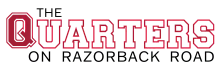 Vibrant logo of The Quarters on Razorback Road in bold red and black typography.