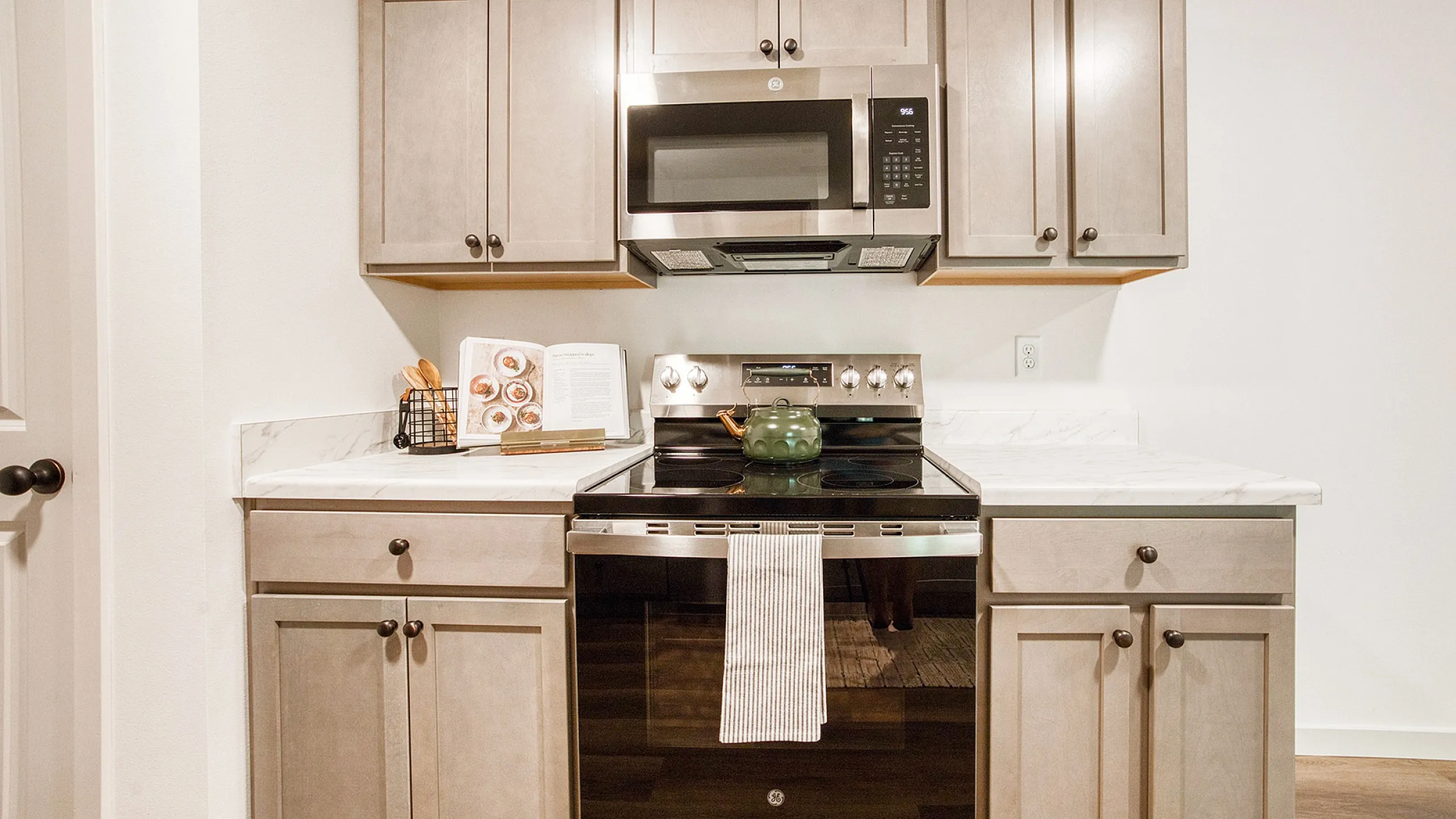 Modern kitchen with sleek cabinetry, stainless steel appliances, and elegant marble countertops.