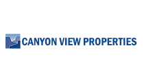 Elegant Canyon View Properties logo featuring a stylized canyon design in blue, representing premium real estate offerings.