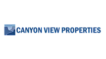 Logo for Canyon View Properties in bold blue lettering with a stylized canyon graphic.