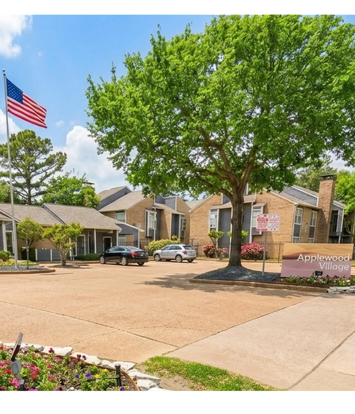 Charming Applewood Village entrance with modern architecture, lush landscaping, and welcoming ambiance.