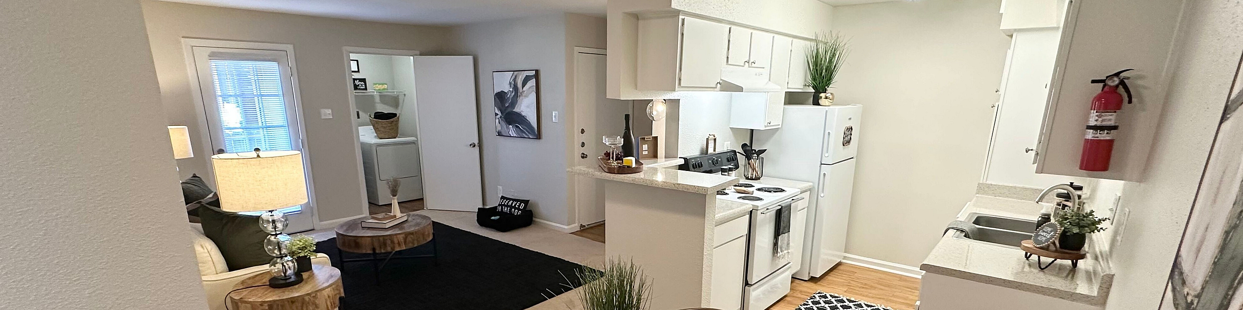 Contemporary apartment interior featuring a cozy open-plan living space with a stylish dining area and a modern kitchen.