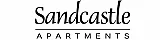 Elegant black and white logo for Sandcastle Apartments, featuring a castle silhouette within a whimsical cloud design.