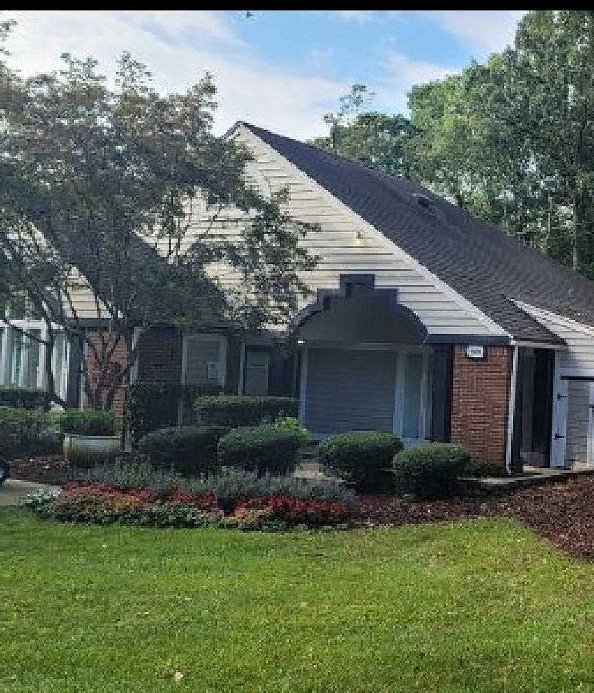 Charming residential property with a stylish facade, surrounded by lush greenery and vibrant landscaping at The Villages.