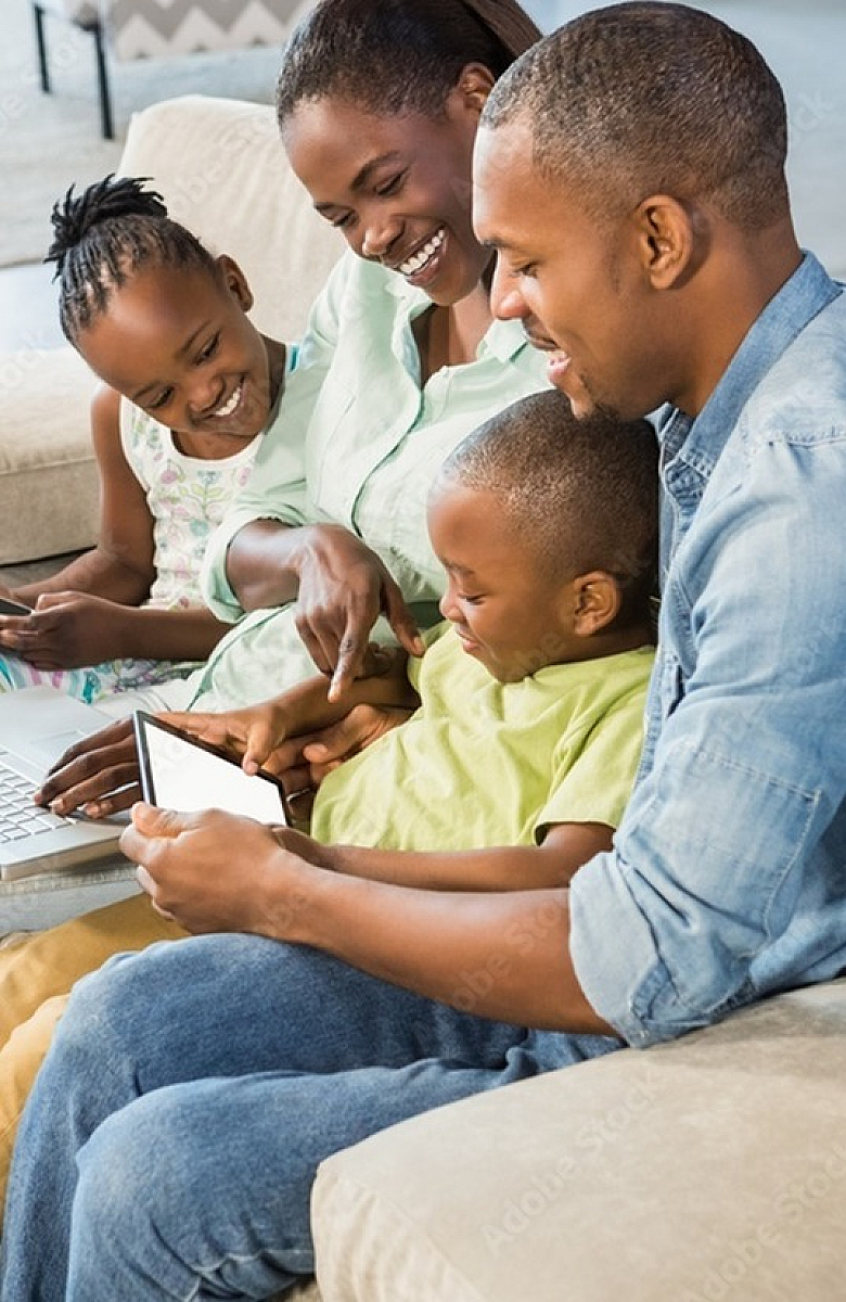 Joyful family bonding time in a bright living room, highlighting the warmth and comfort of home.